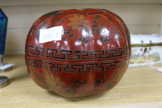 A Chinese lacquer pumpkin shaped box and cover